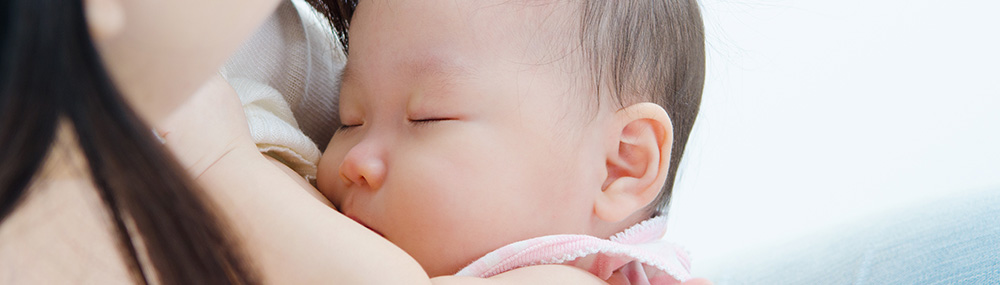 A mother breastfeeding her baby.