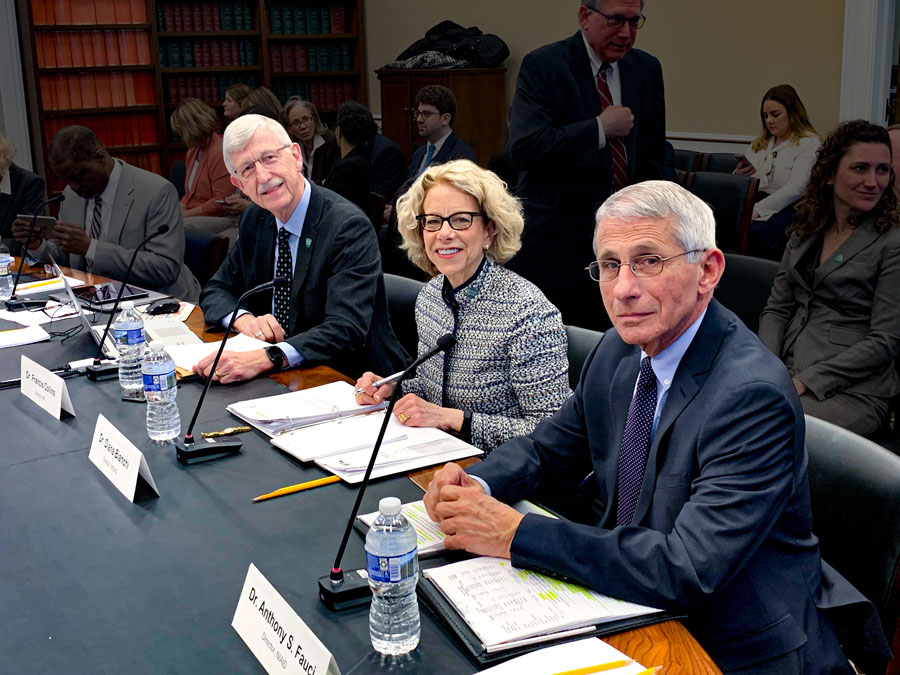 Francis Collins, Diana Bianchi and Anthony Fauci seated at a table.
