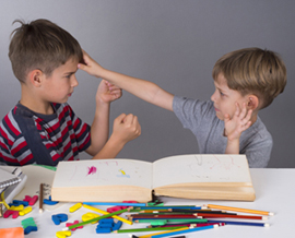 Stock photo of two boys playing with each other
