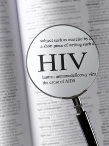 Magnifying glass and dictionary, with HIV enlarged