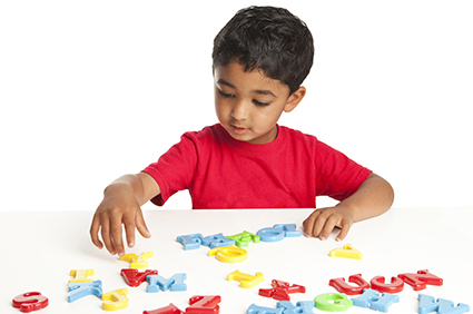 Boy playing with alphabet