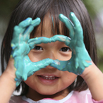 Child with paint on hands