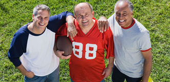 3 older men playing football