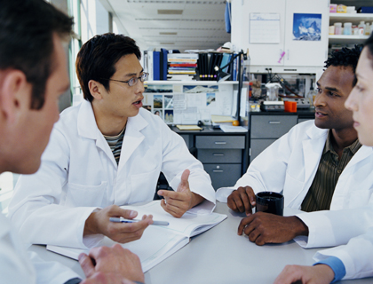 Scientists sitting at a table