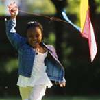 small child flying a kite