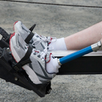 Man with prosthetic on rowing machine