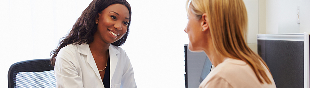 A woman talking with a health care provider