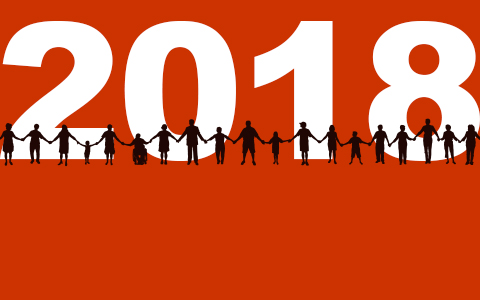 A line of people varying in age, sex, and disability. Behind them is the year, "2018."