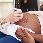 A pregnant woman undergoing an ultrasound scan.