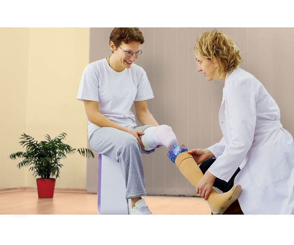Stock image of a patient receiving a prosthetic device.