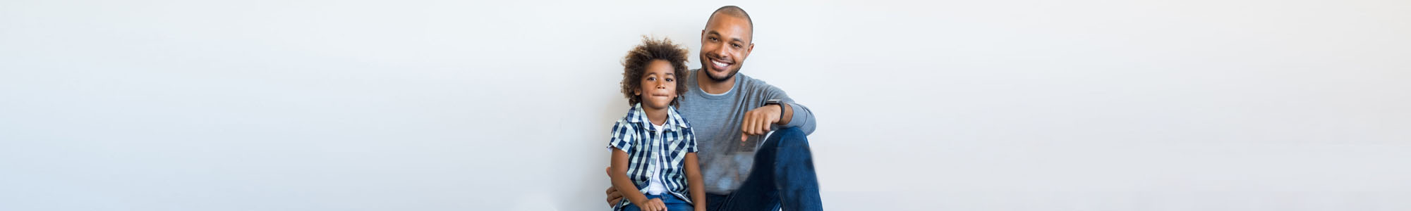A father and son sitting.