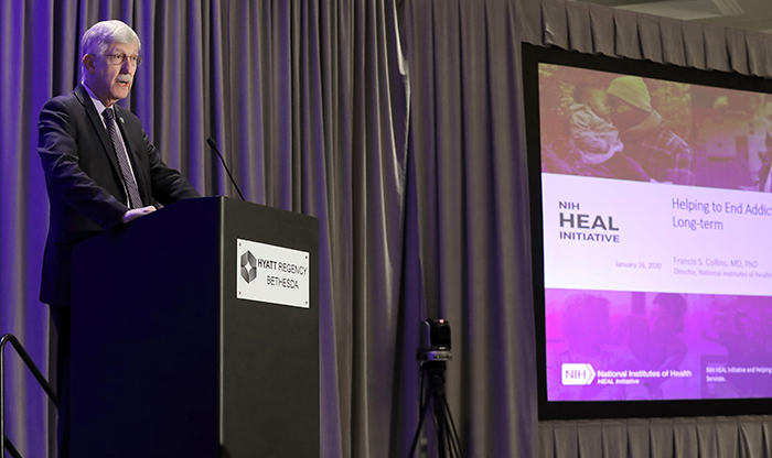 NIH Director Dr. Francis Collins standing at a podium.