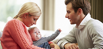Mother and father with newborn baby.