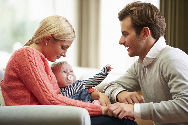 Mother and father with newborn baby.