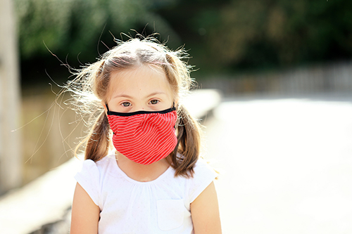 Girl wearing protective face mask.