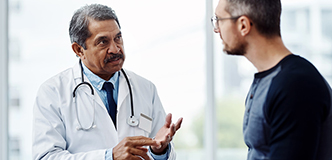 Doctor talking with a man.