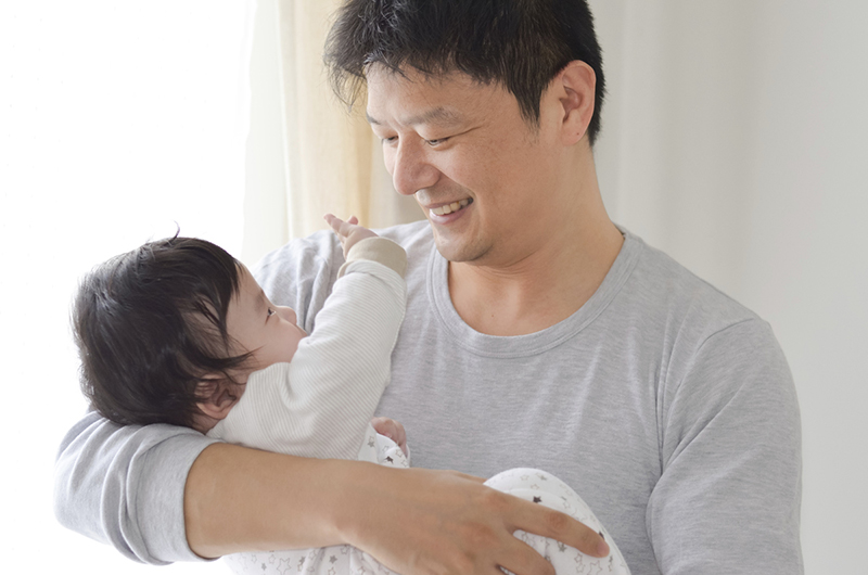 Man holding infant.