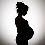 Silhouette of a pregnant person.