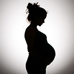 Silhouette of a pregnant woman.