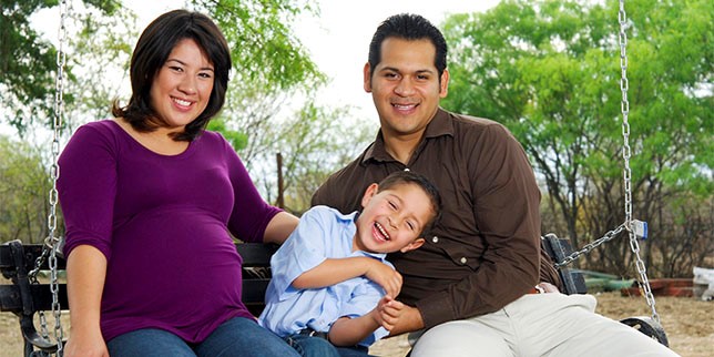 Smiling family in park.