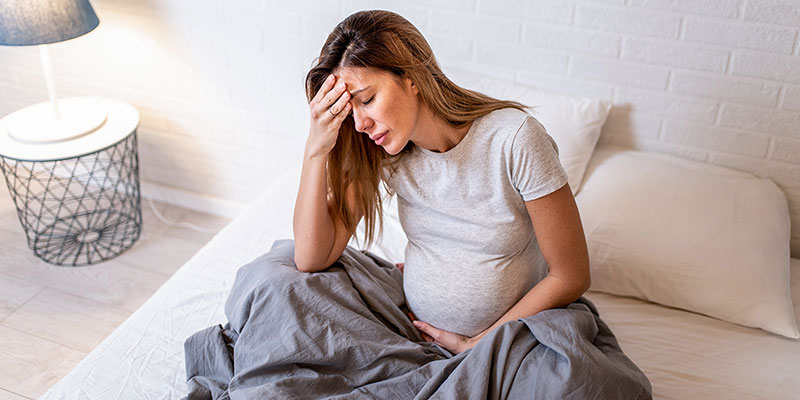 Pregnant person appearing upset.
