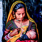A mother holding her infant.