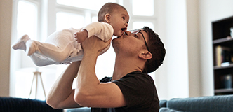 Father holding baby.