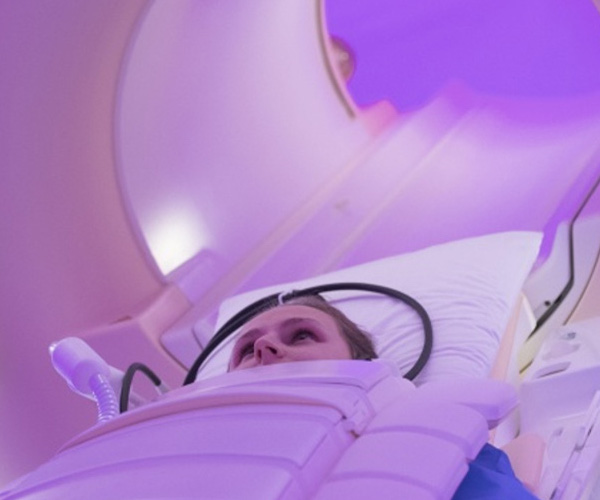 A person in a magnetic resonance imaging scanner.