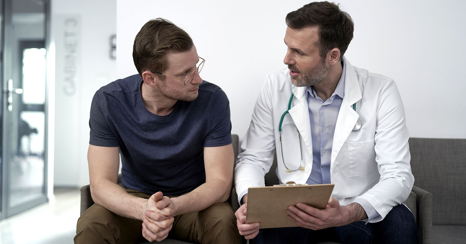 Patient talking with health care professional.