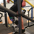 A user demonstrating the prosthetic limb used in the study.
