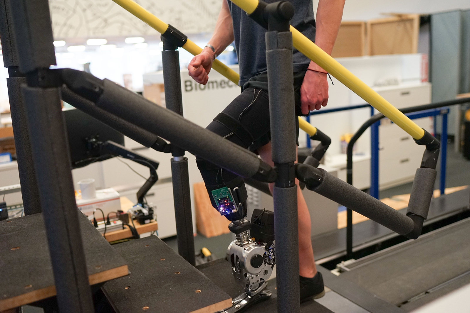 A user demonstrating the prosthetic limb used in the study.