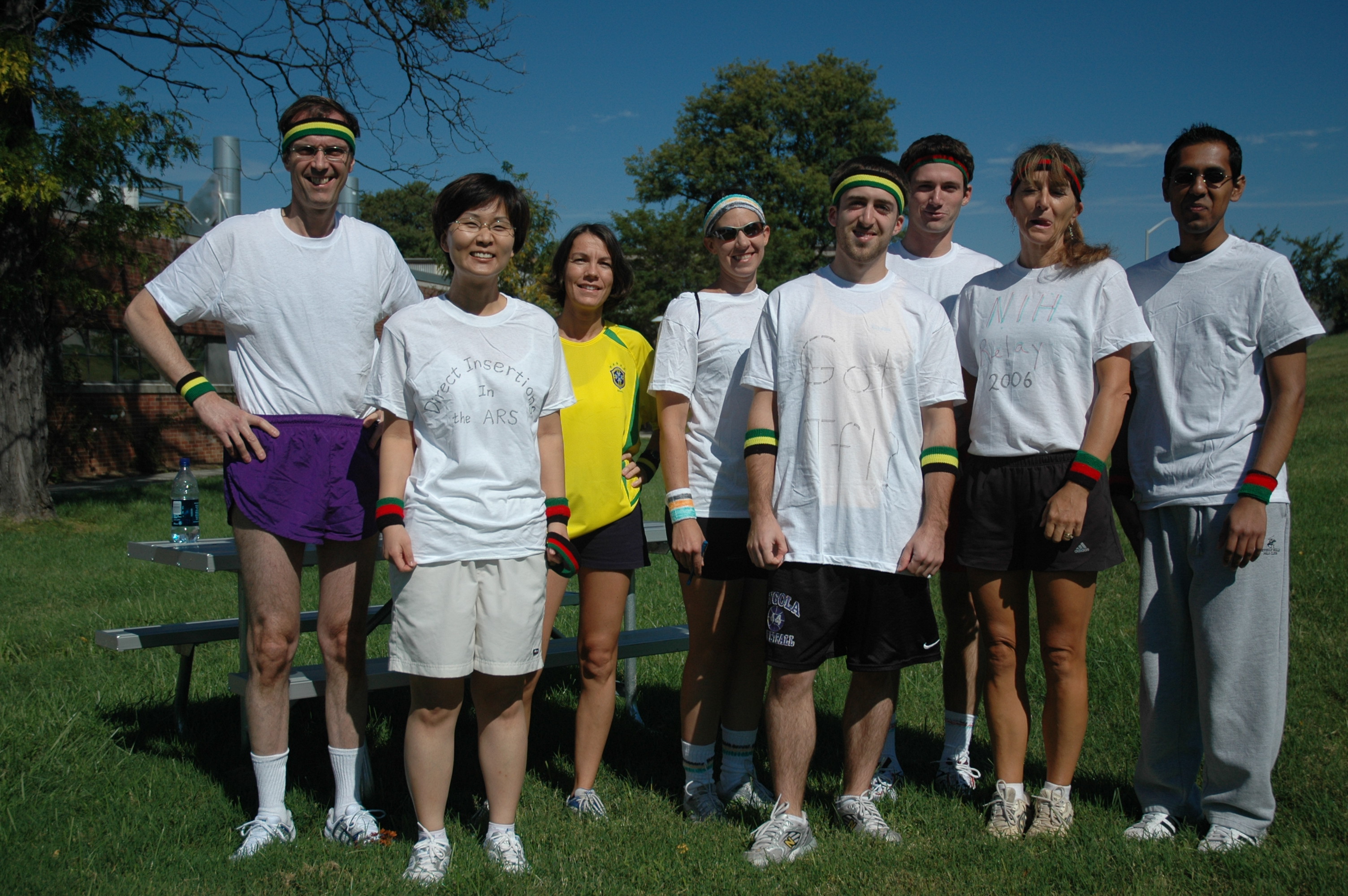 Eight lab members standing on a field after running the 2006 NIH relay race.