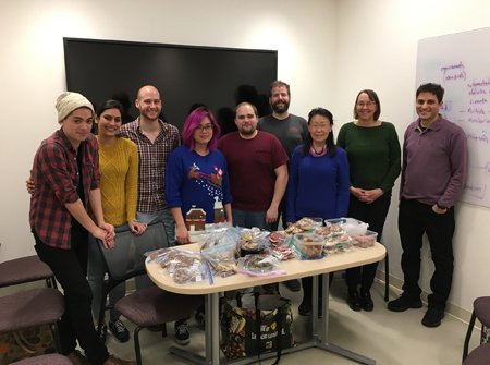 Lab staff eating cookies.