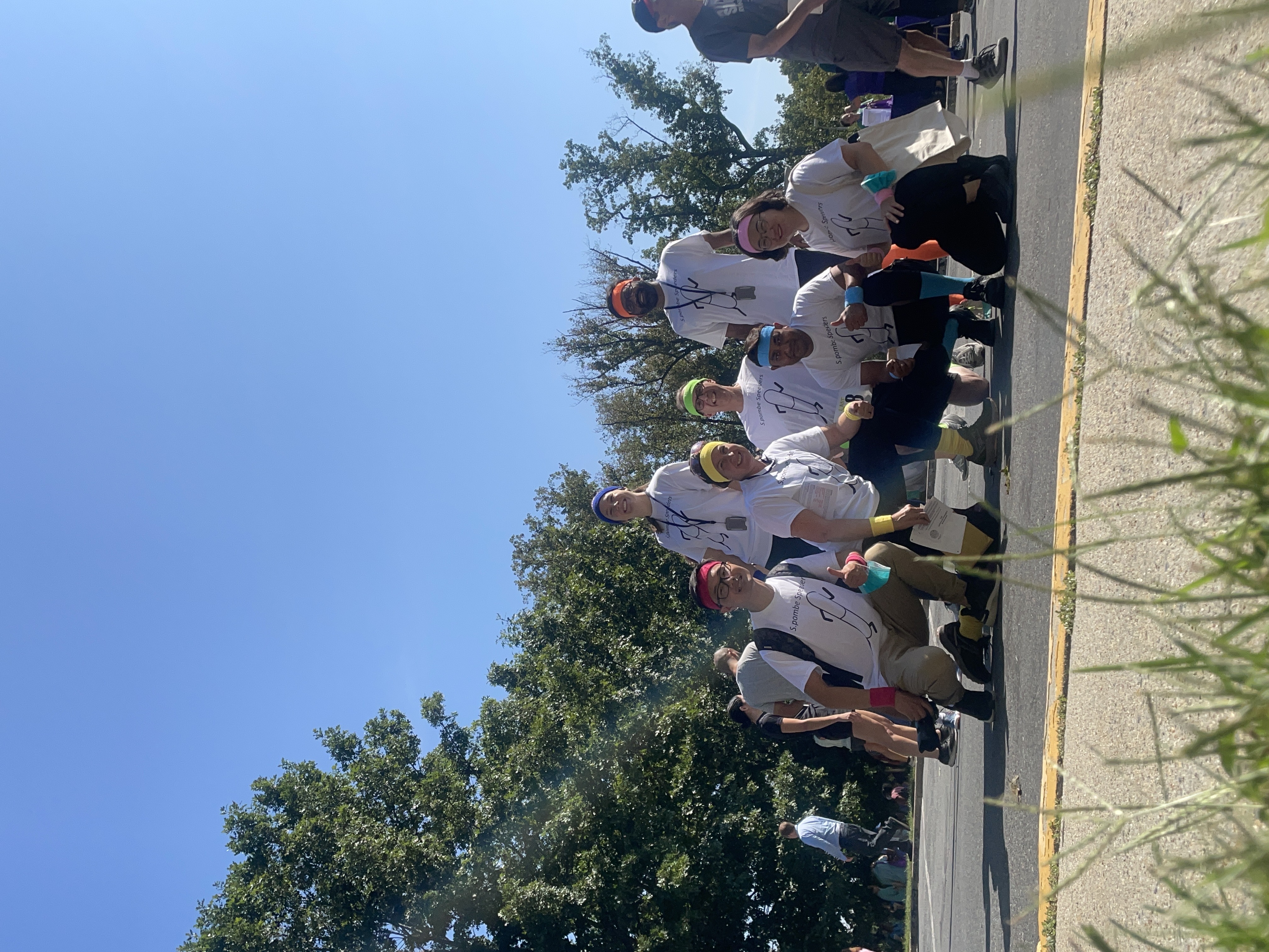 Members of the Levin lab pose outside in matching white shirts  after running the 2022 NIH relay race.