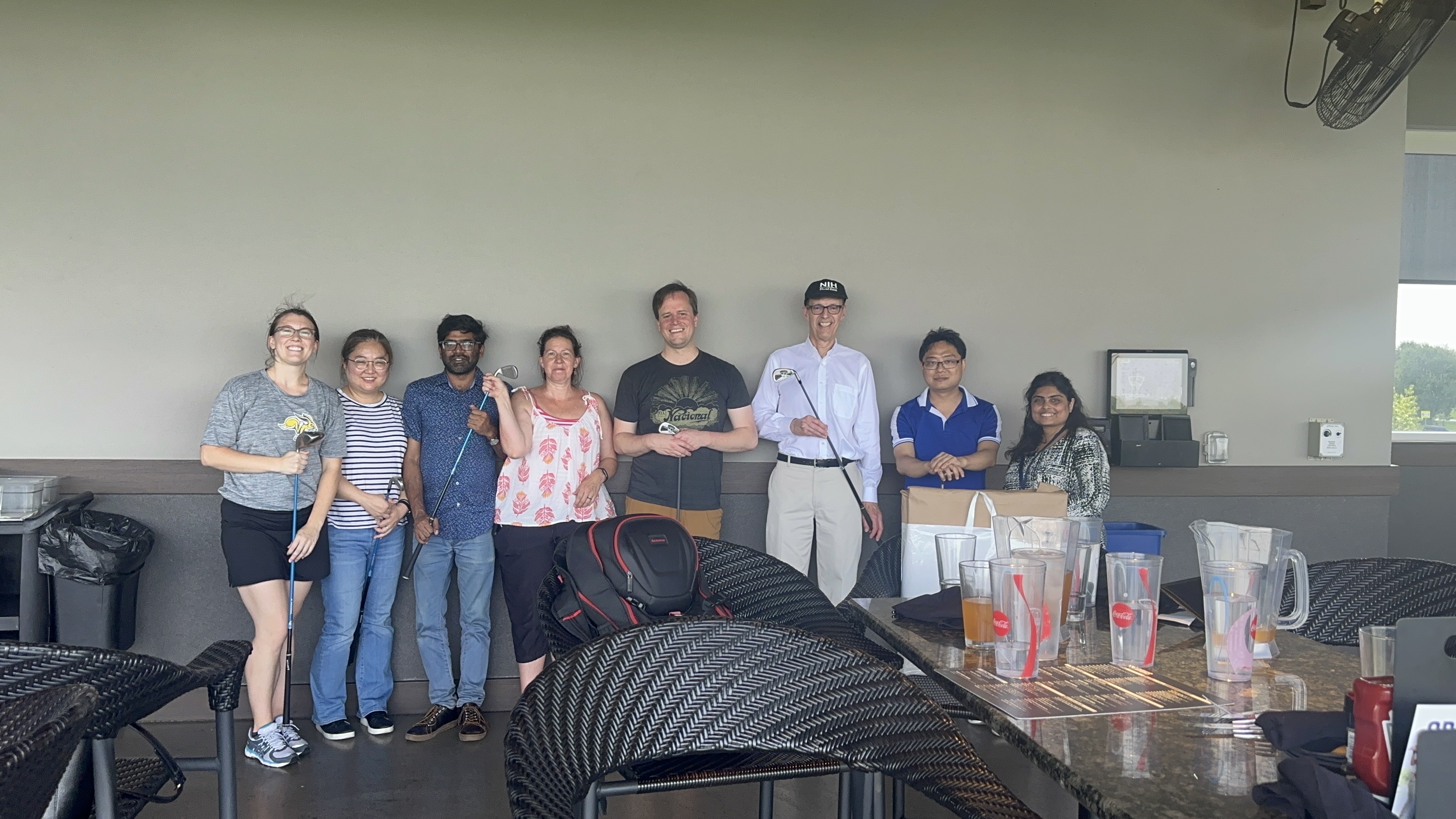Group photo of lab members after playing golf in 2023. 