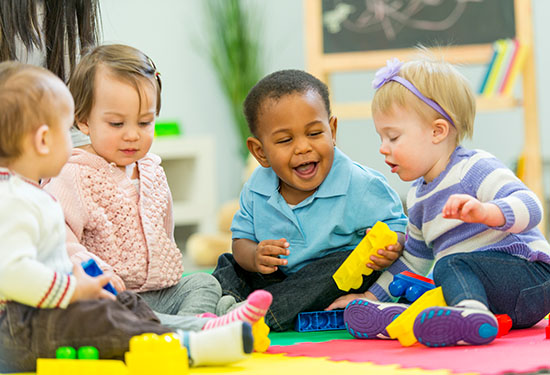 Stock image of young children playing