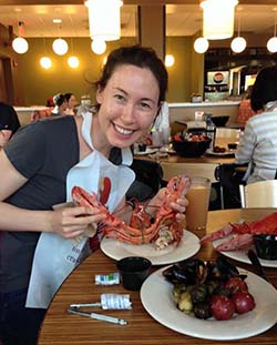 Fellow holding a Lobster at Lobster Dinner.