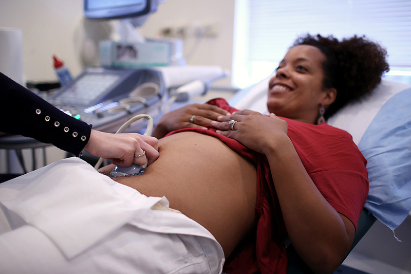 A pregnant woman undergoing a sonogram.