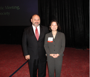 Dr Jack Yanovski and Dr Joan Han stand with award.