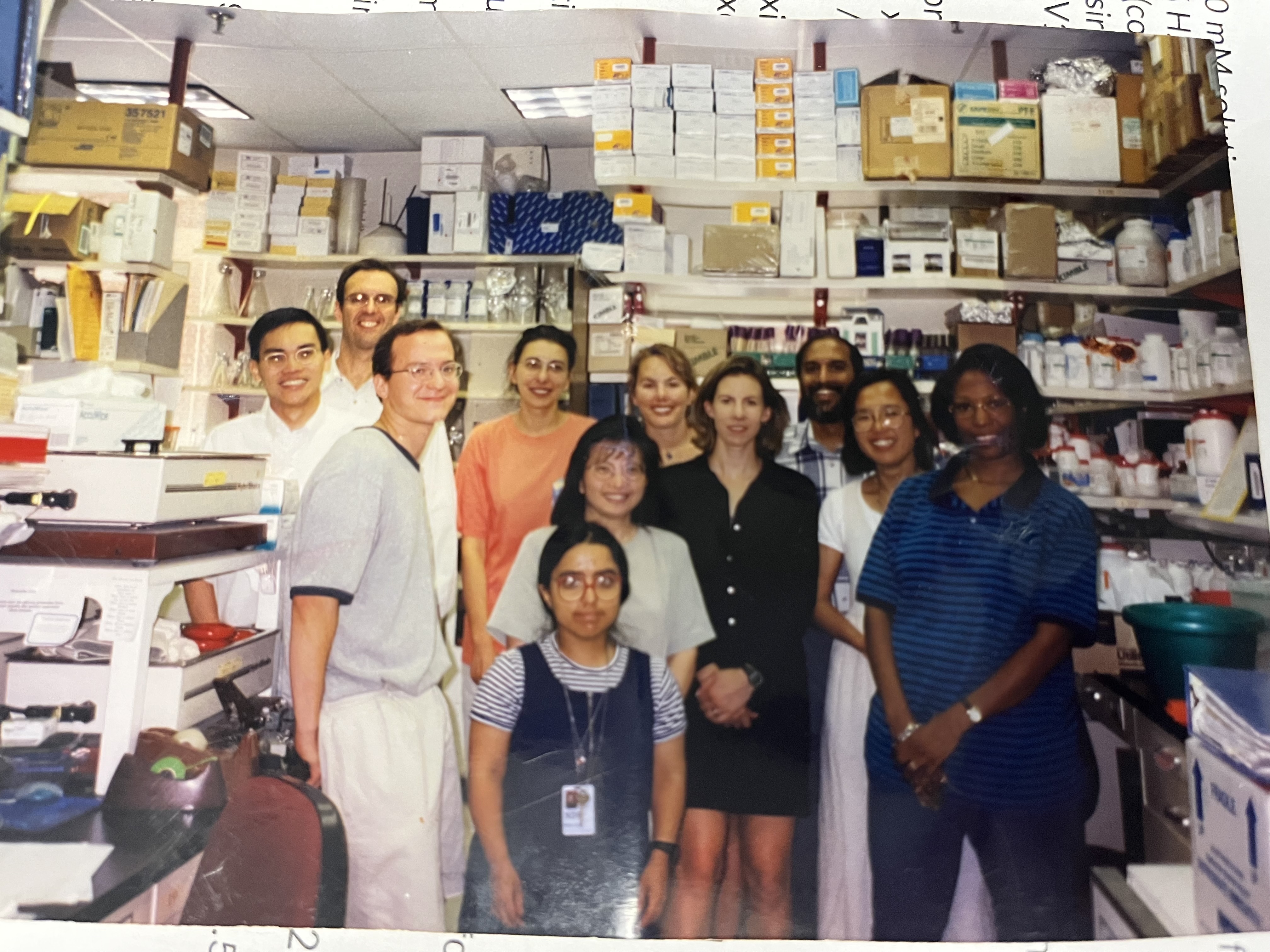 Eleven lab members standing together in the Levin lab located in building 6B.