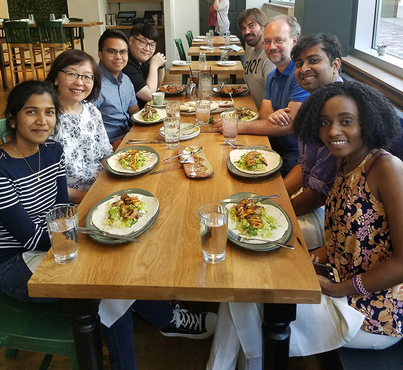 Group photo of the lab at a goodbye lunch for Brigdet Njeri in August 2018.