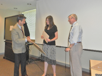 Fellow receiving diploma from Dr. Stratakis at ceremony.