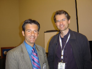 2 doctors standing at a conference.