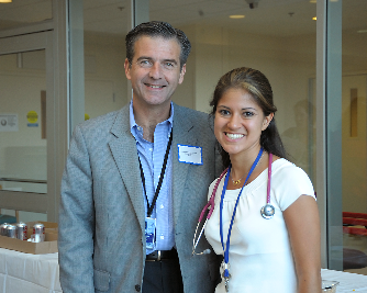Dr. Stratakis and fellow smiling.