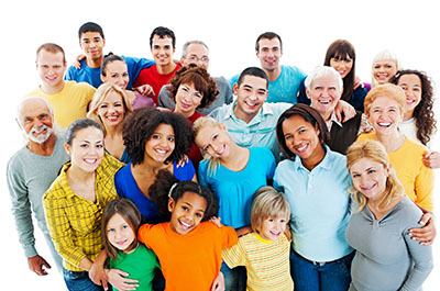 Portrait of a large group of diverse, mixed-age people smiling and hugging.