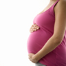 Pregnant woman holding her belly.