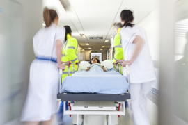 Little girl in a gurney in an emergency room