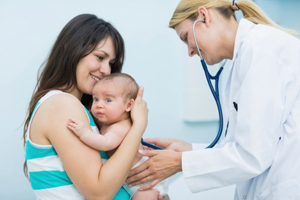 Mother and child with healthcare provider.