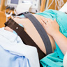 Pregnant woman in hospital bed.