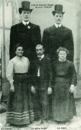 Familial gigantism in the two Hugo brothers. Top row: Battista Ugo (Baptiste Hugo), 1876–1916, reached a height of 2.30 m (7 ft, 7 in) and Paolo Antonio Ugo (Antoine Hugo), 1887–1914, reached a height of 2.25 m (7 ft, 5 in). Bottom row: the parents of the Ugo brothers, Teresa Chiardola (1849–1905) and Antonio Ugo (1840–1917), and their sister, Maddalena Ugo (1885–1960). Picture from the collection of Dr. W. W. de Herder.